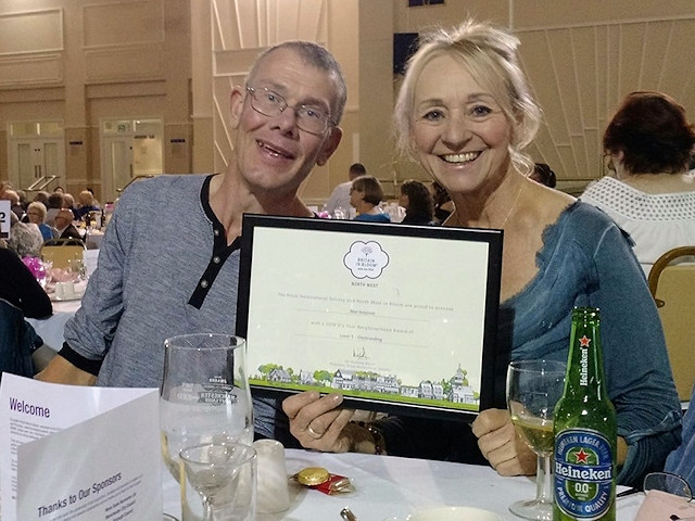 Bee Inspired's Danny Bennett and Pauline Cooper with one of their awards