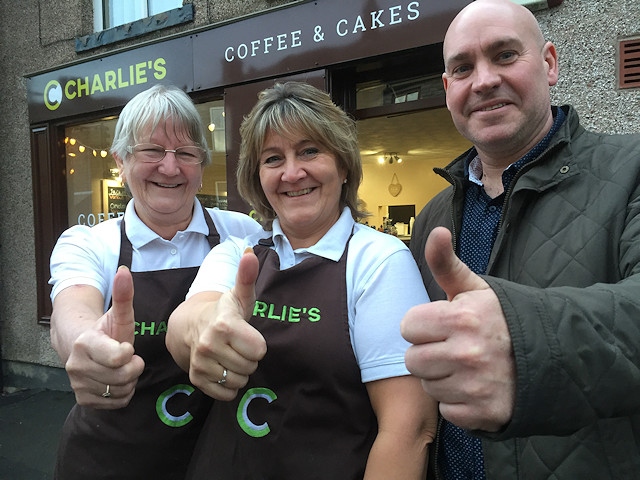 Charlie's Café owner Tracy Charlson (centre) and mum Margaret are welcomed to Wardle village by Julian Farnell