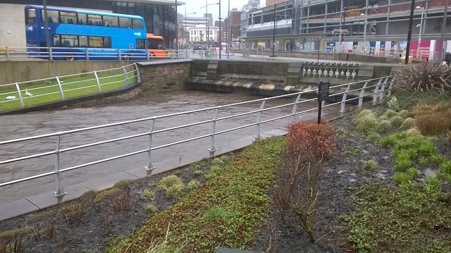 River Roch in Rochdale town centre is dangerously high, with the river just inches/centimetres from the top of the of the bridge at One Riverside and Rochdale bus station - 3.00pm Saturday 16 March 2019