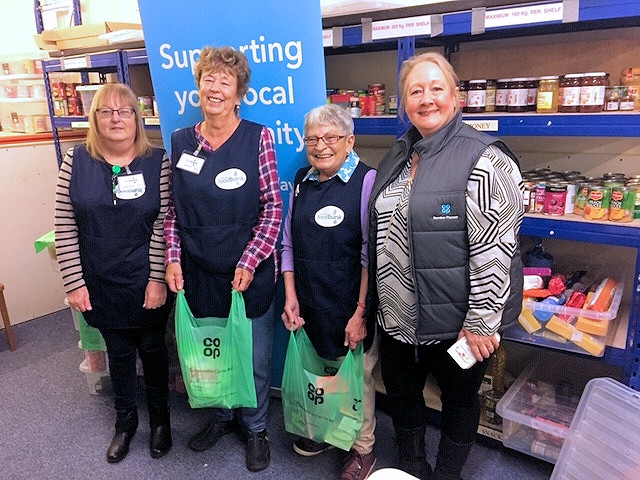 Rochdale Foodbank volunteers with the compostable Co-op carrier bags