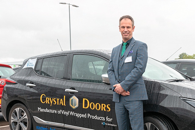 Richard Hagan, managing director, Crystal Doors, with his electric Nissan Leaf car