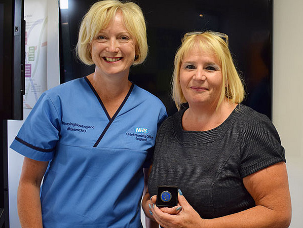 Chief Nursing Officer for England, Ruth May (left) presented an award to Mental Health Manager, Gill Drummond (right)
