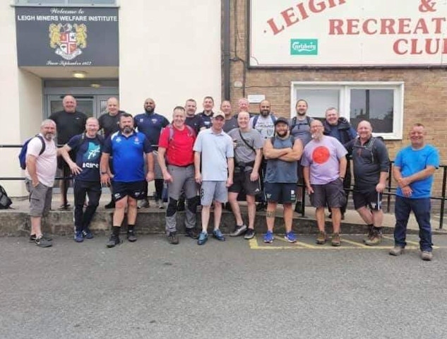 21 rugby friends walked from Mayfield to Leigh Miners (pictured here at Leigh)