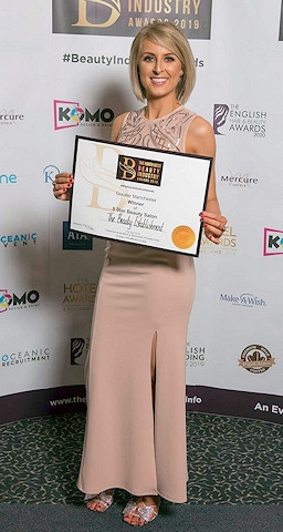 Lucy Atherton, owner of The Beauty Establishment, celebrating her Greater Manchester Five Star Beauty Salon of the Year Award win