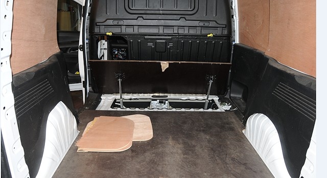 The drugs were hidden under the floor in the back of the van