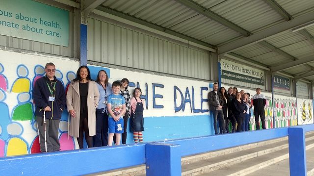 Rochdale AFC club staff, Councillor Rachel Massey and the Falinge Community Hub students