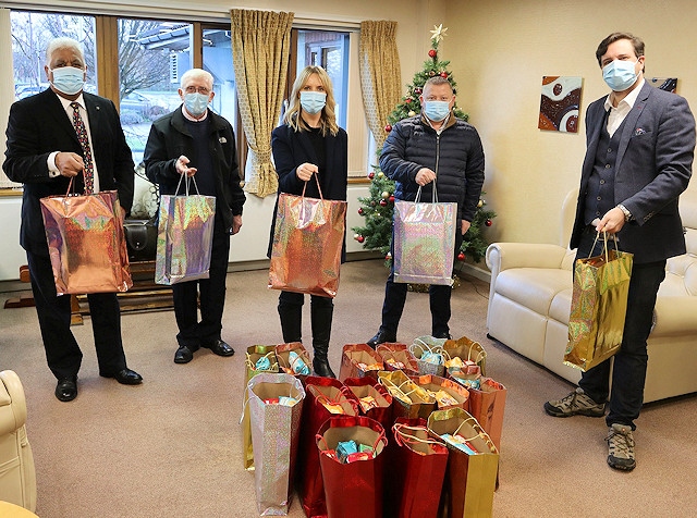 The Rochdale District Freemasons donating the gift bags at the hospice with Sam Wells, CEO of Springhill Hospice