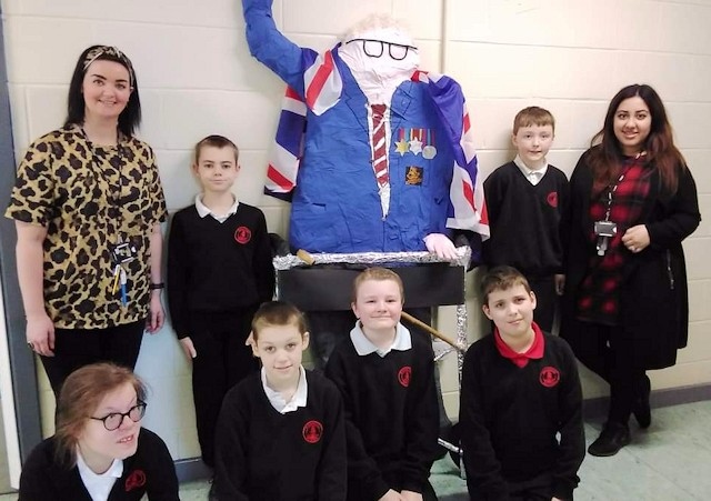 Year 7 pupils and teachers at Redwood School with their statue of Captain Sir Tom Moore
