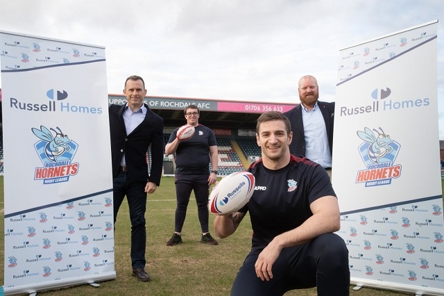 L-R: Andrew Russell, joint managing director of Russell Homes, Eliot Scanlon-Wells, Community Coach, Hornets player Gavin Bennion (front) and club CEO Steve Kerr
