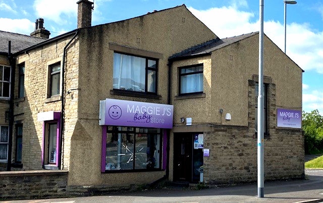 The exterior of Maggie J's Baby Store, Milnrow