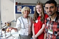 Former pupils Rebecca Thornley and Mukhtar Abu Ghani showcase the exceptional science facilities at Oldham Sixth Form College during a recent visit by Lady Ogden.