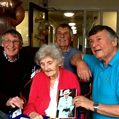 Catherine (Ena) with her three sons: Paul (left), eldest Peter (back) and the youngest Jeff (right) and her 100th birthday card from the Queen