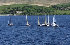 Boats line up for the start of a race