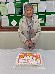 Edna Burrows cuts her birthday cake