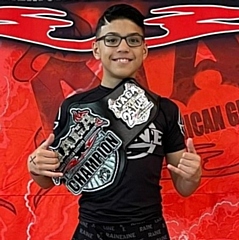 Andrew Perez with his champion belt