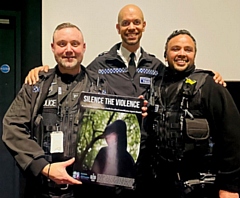 Danny Inglis Chief Superintendent and police officers holding the Silence the Violence poster at the premiere