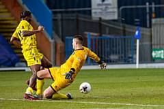 Devante Rodney puts the ball past the keeper before scoring the equaliser