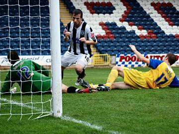 Le Fondre puts the ball in at the far post for what he thinks is the winning goal