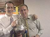 Spotland Methodists Football Club members - Mark Buffery and Chris Watson - proudly holding the Trophy