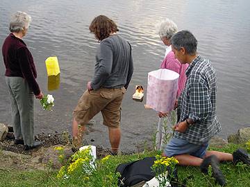 Members of the Peace Group watching lanterns float on the Lake