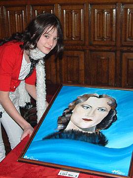 Alicia France with her painting of Gracie Fields