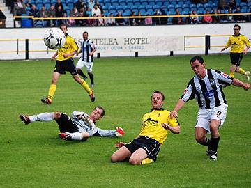 A Southport defender clears for a corner under pressure from Chris Dagnall