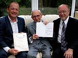 Simon Danczuk (left) & Jim Dobbin MP (right) celebrate George Cousin's birthday with him