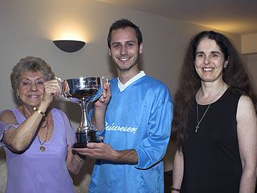 Ann Kenny (left) presents the trophy with Pauline Journeaux, to Opal Fruits Captain Andy Kibble