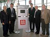 Transport Minister Derek Twigg unveils a plaque to commemorate the opening of the new bus station