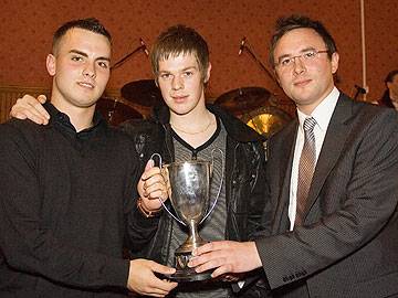 Catholic Club receive the First Division trophy from Howard Ryder of Carcraft