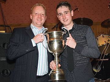 Copperpot Reserves receive the Second Division trophy from Wayne Melvin of Carcraft