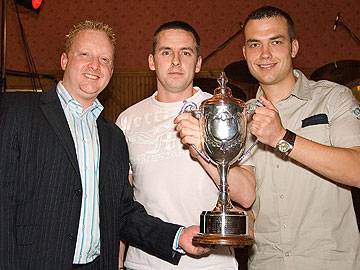 Copperpot receive the Premier Division trophy from Wayne Melvin of Carcraft