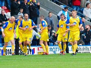 Chester players celebrate their late winner