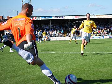 Wayne Brown kicks the ball upfield