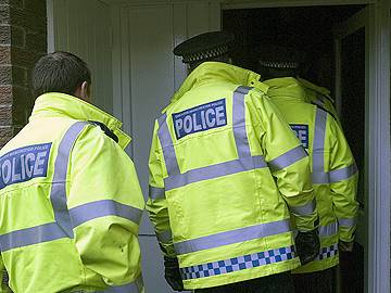 Police raid a house