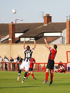 Higginbotham defies his lack of inches to win a header