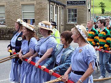 The Milltown Cloggies carry the Rushcart on parade