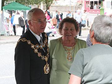 Rochdale Mayor Peter Evans and Mayoress Helen talk to the Littleborough in Bloom stall holder