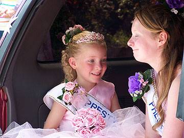 One of the youngest carnival queens enjoys the parade in the sun