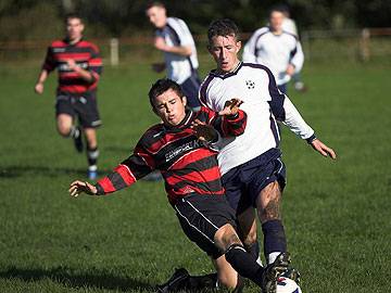 Lewis Rowland wins the tackle