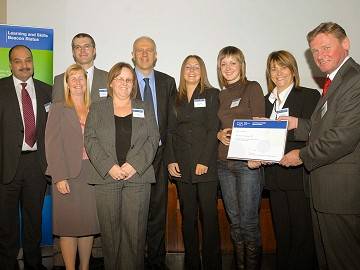 Bill Rammell, Minister of State for Lifelong Learning, Further and Higher Education, presents Learning and Skills Beacon status to Manchester Training