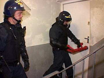 Police break down door on drugs raid