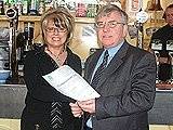 Licensing Manager John Fletcher hands over the new licence to Bar 5 Owner Jayne Warcaba