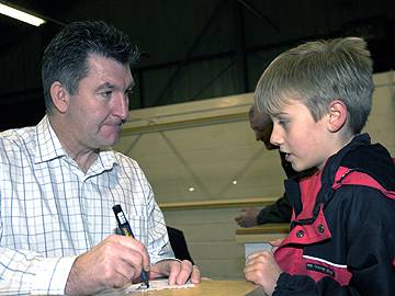 Norman Whiteside Signs Autograph for Young Fan