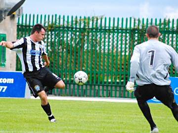 Chris Dagnall fires a shot at Northwich keeper Andrew Murphy