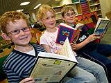 Young bookworms enjoying reading