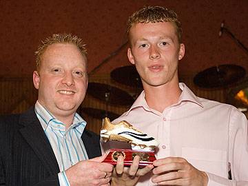 Joint Overall leading goalscorer J Scholes (Broadway Celtic) receives his trophy from Wayne Melvin of Carcraft