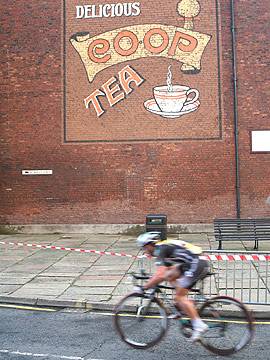 A cyclist rides past the old Co-op building on Toad Lane