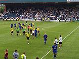 The players leave the pitch after the game at Spotland