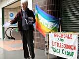 Pat Sanchez distributing leaflets to passers-by outside the Wheatsheaf Centre